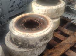 Image Lot of 4 Front NISSAN Forklift Hilo Tires with Rims - 21in X 7in X 15in, Orca PL Grey - 1 from Bid-on-Equipment.com